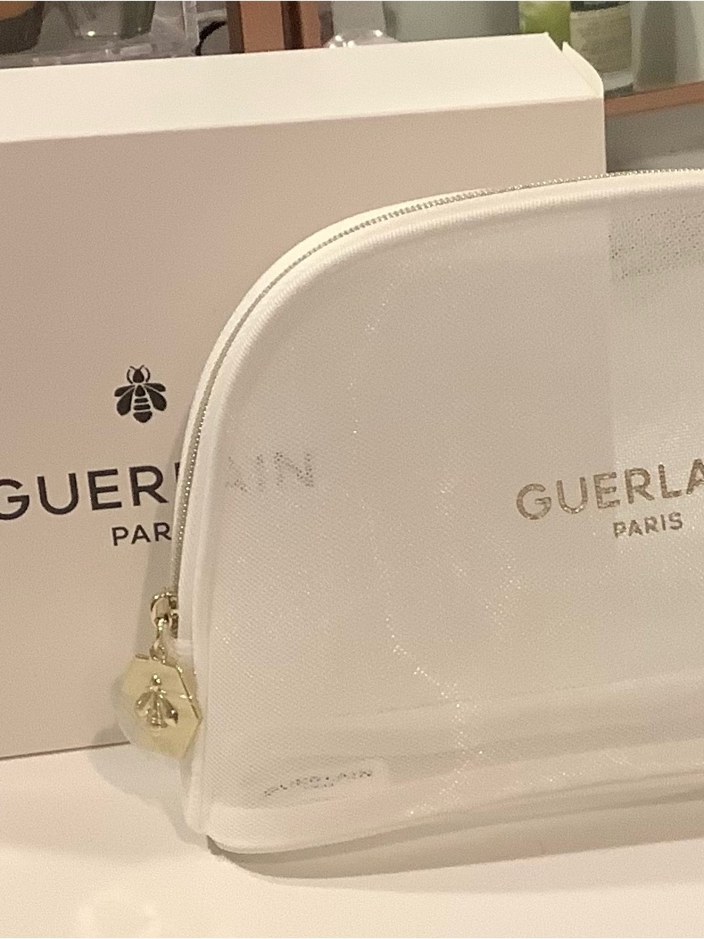 GUERLAIN White Glitter Cosmetic Pouch with Gold Logo